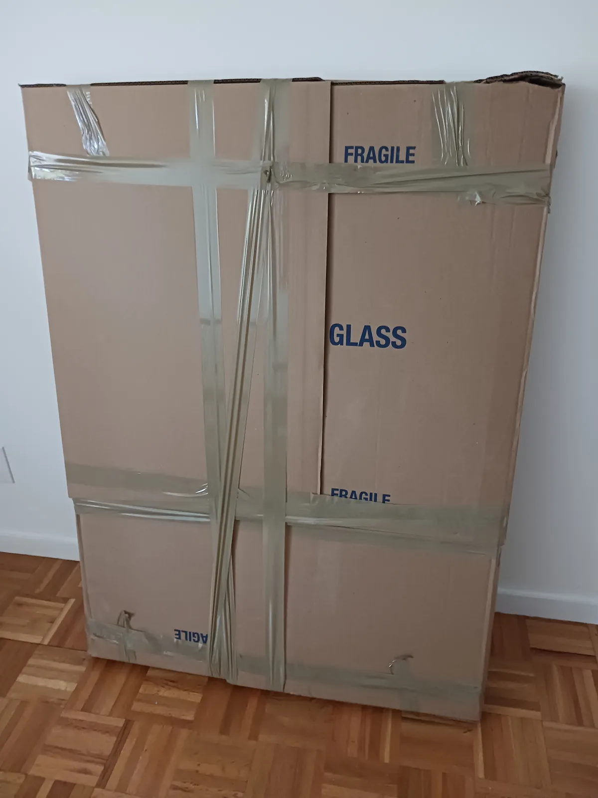 Fragile household items packed and labeled for moving.